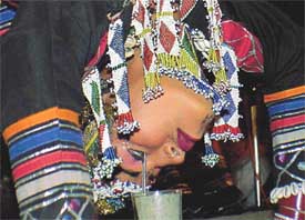 A dancer from Rajasthan performs a rare feat by picking needles with her eyelashes 