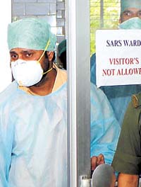 Doctors at a SARS ward in Maharishi Balmiki Infectious Disease Hospital in Kingsway Camp