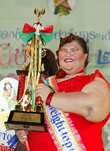 Supaporn Dongkhair, 23, holds the winners trophy after winning the Miss Thailand heaviest contest