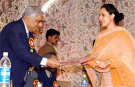 Chief Minister Mufti Mohammad Sayeed presents a medal