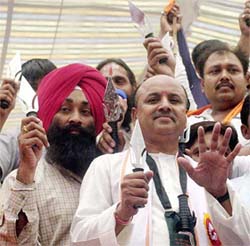 Praveen Togadia of the VHP with  party workers during a "trishul diksha" rally in New Delhi on Sunday