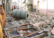 The debris of the house scattered in the street