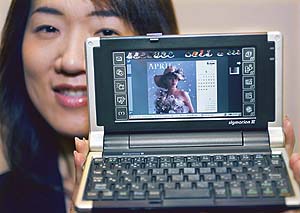 NTT DoCoMos latest handheld PC, the Sigmarion III, is unveiled at a DoCoMo office in Tokyo.