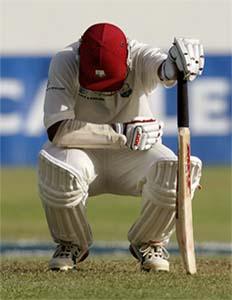 Brian Lara is forced to stop and rest while batting with a high temperature