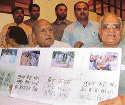 Punjab BJP president Brij Lal Rinwa releases photographs of certain Congress leaders with two satta operators