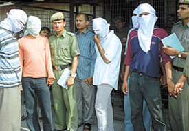 The five youths, including two children of policemen, who have been arrested for murdering the son of a businessman