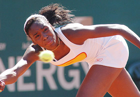 Venus Williams of the US chases a return from Amelie Mauresmo of France