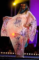 A model displays a caftan designed by Iraqi fashion designer Bassem Al Cheikh Jawad