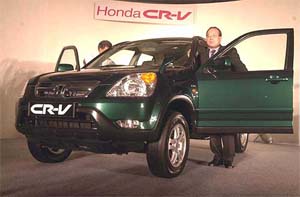 H. Yamada, president and CEO of Honda Siel Cars India limited, launches the new car CR-V in New Delhi 