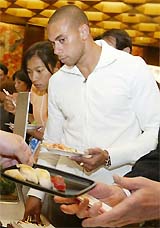 Australian sprinter Patrick Johnson eyes some Japanese sushi