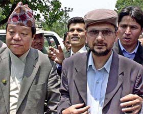 Baburam Bhattarai, a top leader of the Maoist rebels, with government negotiator Narayan Singh Pun 
