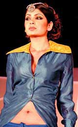 A model displays outfit at a fashion show