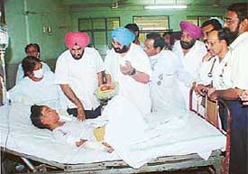 The Chief Minister of Punjab, Capt Amarinder Singh, talks to a victim of Saturdays fire tragedy in the Khud Mohalla area