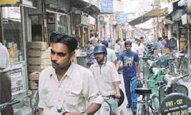The narrow Pindi Street which remains choked with bicycles, cycle-rickshaws and scooters parked there