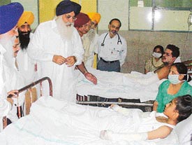 Mr Parkash Singh Badal, former Chief Minister, talks to persons injured in Saturdays fire tragedy