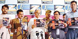 Haryana Governor Babu Parmanand (centre) releases the brochure of ‘Mission Akshardham’, a Zee TV’s telefilm, at a function organised at Hotel Mountview in Chandigarh on Wednesday.
