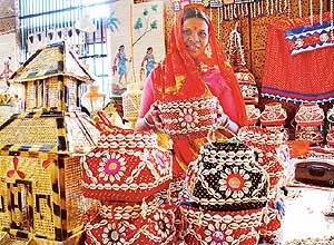 A woman from Chhattisgarh shows her creations at an exhibition of handicrafts and handloom, Shabari, being held at Lajpat Rai Bhavan in Chandigarh on Wednesday.