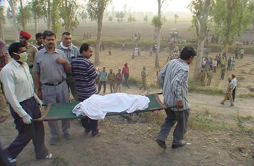 A body being removed from the accident site.
