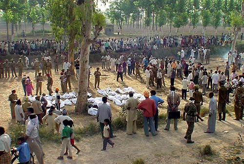 Bodies of victims are collected on a spot for identification.