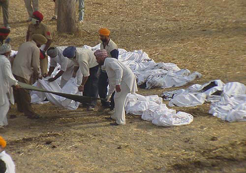 Bodies removed from the train being collected at a spot.