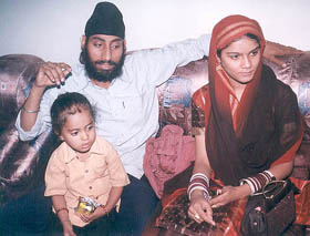 Surjit Singh with his newly wedded wife Manmeet Kaur from Meerut who survived the train fire.