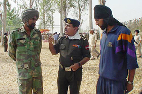 Well done boys, says Brig Sunil Dhawan to Hav Bhagwan Singh (left) and Hav J. D. Singh.