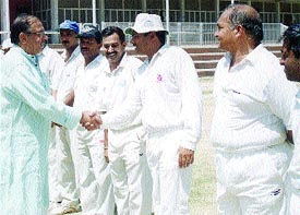 Delhi and District Cricket Association sports secretary Sunil Dev meeting the players of the Veterans Cricket Championship match between Vidarbha and Assam 