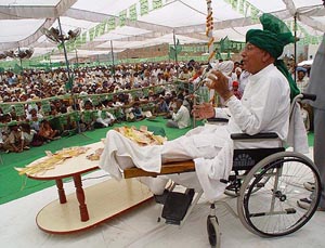 Mr Om Prakash Chautala, Haryana Chief Minister, addresses an election rally sitting on a wheelchair at Aharvan village in Fatehabad district on Sunday.