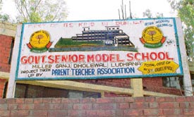A signboard of the school giving details about the PTA project