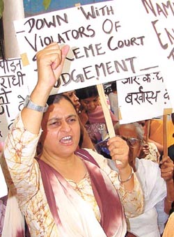 Activists of the National Federation of Indian Women demonstrating outside Marina Hotel in the Capital on Tuesday demanding the reinstatement of Kalyani Satpathy in her job