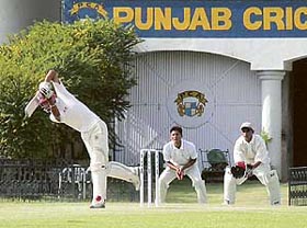 A match between Minor Districts and the Chandigarh Club in progress at the PCA Stadium, SAS Nagar, on Friday
