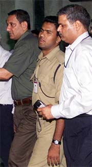 Security personnel take away 22-year-old constable R. Namdeo