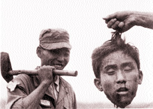 South Koreans proudly display the head of a guerrilla from the North (1952)
