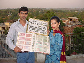 Rajesh Kaushal of Hamirpur along with his rare collection of currency notes and coins
