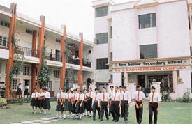Students of New Senior Secondary School in front of the school building