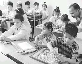 The visually impaired at the Institute for the Blind learn to write braille with the help of slates