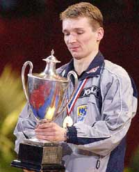 Werner Schlager of Austria holds his trophy after winning the mens singles final at the World Table Tennis championships