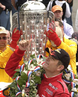 Marlboro Team Penske driver Gil de Ferran of Brazil acknowledges cheers from the crowd after winning the 87th Indianapolis 500 race