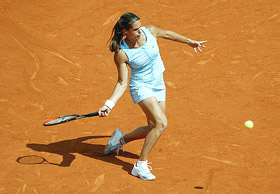 Amelie Mauresmo of France returns to fellow country women Virginie Razzano 