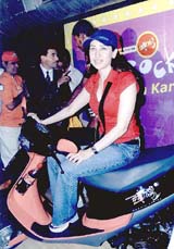 Bollywood actress Karishma Kapoor launches "Zing Rockin", a new variant of Kinetic youth scooter