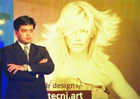 Mr Vismay Sharma poses with a models photograph in Tress Lounge in Sector 8