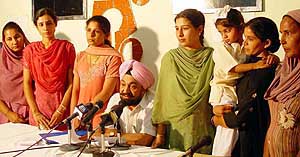 Aggrieved by their NRI grooms, women from various parts of Punjab narrate their tales of woe to the media at Chandigarh Press Club in Chandigarh on Tuesday. Sitting in the middle is Mr B.S. Ramoowalia, former Union minister