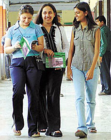 Students who cleared the CBSE class XII exams recently pore over their admission forms as they amble down the Hindu College corridor in the Capital 