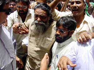 Jharkhand Mukti Morcha supremo Shibu Soren along with his supporters is arrested outside the Governors residence in Ranchi on Wednesday 