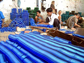 Workers busy manufacturing glass bangles