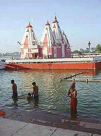 Pilgrims take a dip in Sarovar on the eve of the solar eclipse at Kurukshetra