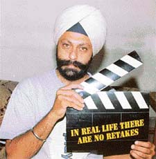 Dr Deepinder Singh shows the theme of No Tobacco Day 2003