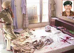 An Inspector of the Punjab Police inspects the spot where constable Heera Lal (inset) shot dead his son at his house in Naya Goan on Saturday