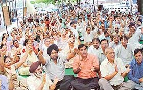 Members of the Chandigarh Residents Welfare Associations oppose the anti-encroachment drive