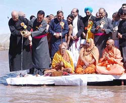 Deputy Prime Minister L.K. Advani pours water